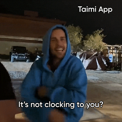 Justin Bieber, wearing a blue hoodie, talks to the camera while pointing at his head
