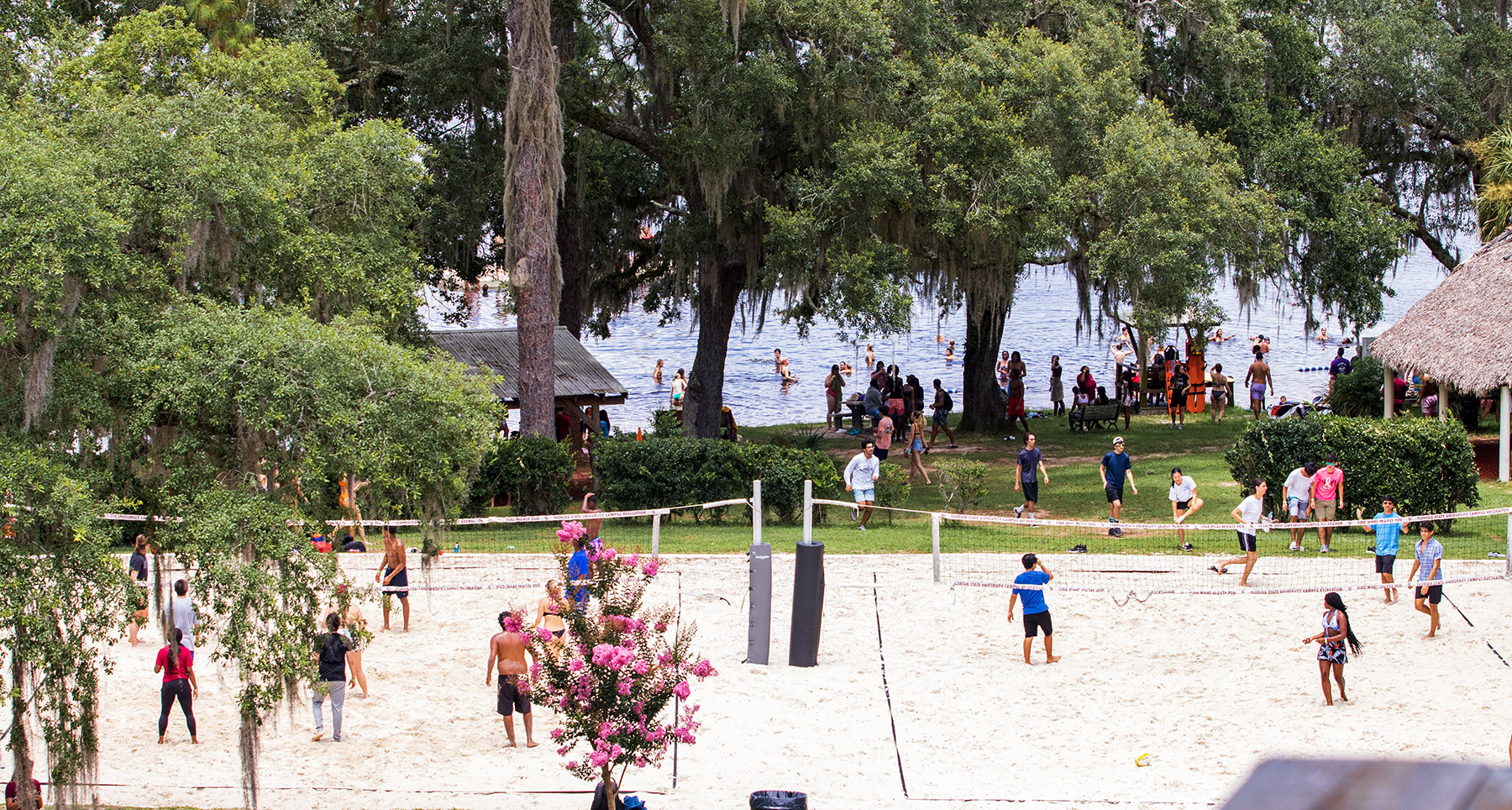 people playing beach volleyball at the rez